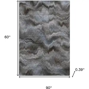 Photo of Taupe And Gray Abstract Washable Area Rug With UV Protection