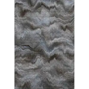 Photo of Taupe And Gray Abstract Washable Area Rug With UV Protection
