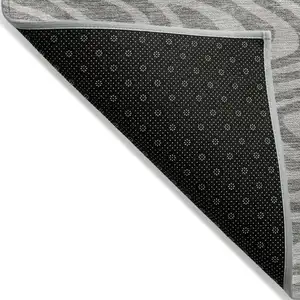 Photo of Taupe And Gray Abstract Washable Indoor Outdoor Area Rug
