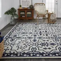 Photo of Taupe And Gray Wool Floral Tufted Handmade Stain Resistant Area Rug