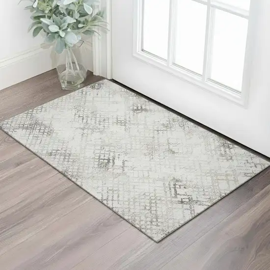 Taupe And Ivory Abstract Geometric Washable Area Rug With UV Protection Photo 1