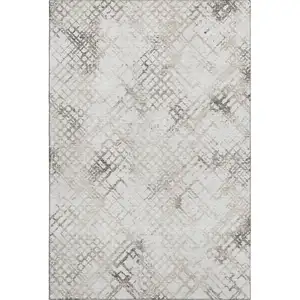 Photo of Taupe And Ivory Abstract Geometric Washable Area Rug With UV Protection