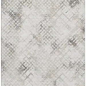 Photo of Taupe And Ivory Abstract Geometric Washable Area Rug With UV Protection