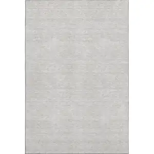 Photo of Taupe And Ivory Abstract Geometric Washable Area Rug With UV Protection