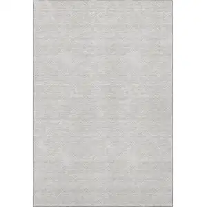 Photo of Taupe And Ivory Abstract Geometric Washable Area Rug With UV Protection