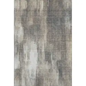 Photo of Taupe And Ivory Abstract Washable Area Rug With UV Protection