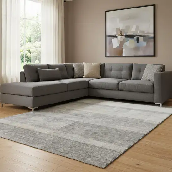 Taupe And Ivory Abstract Washable Area Rug With UV Protection Photo 1