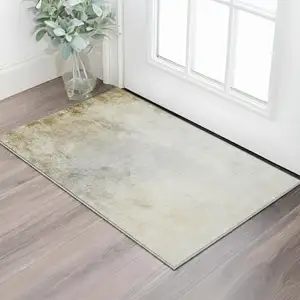 Photo of Taupe And Ivory Abstract Washable Area Rug With UV Protection