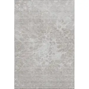 Photo of Taupe And Ivory Abstract Washable Area Rug With UV Protection