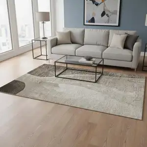 Photo of Taupe And Ivory Abstract Washable Area Rug With UV Protection