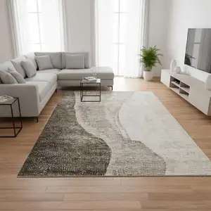 Photo of Taupe And Ivory Abstract Washable Area Rug With UV Protection