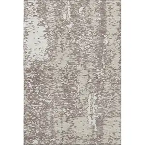 Photo of Taupe And Ivory Abstract Washable Area Rug With UV Protection