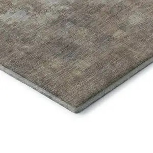 Photo of Taupe And Ivory Abstract Washable Area Rug With UV Protection