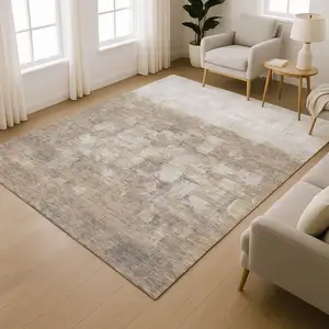 Photo of Taupe And Ivory Abstract Washable Area Rug With UV Protection