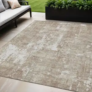 Photo of Taupe And Ivory Abstract Washable Indoor Outdoor Area Rug