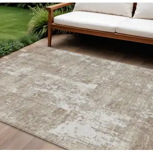 Photo of Taupe And Ivory Abstract Washable Indoor Outdoor Area Rug