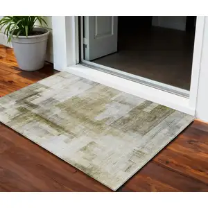 Photo of Taupe And Ivory Abstract Washable Indoor Outdoor Area Rug