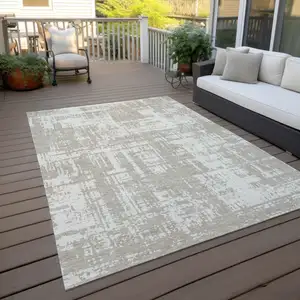 Photo of Taupe And Ivory Abstract Washable Indoor Outdoor Area Rug