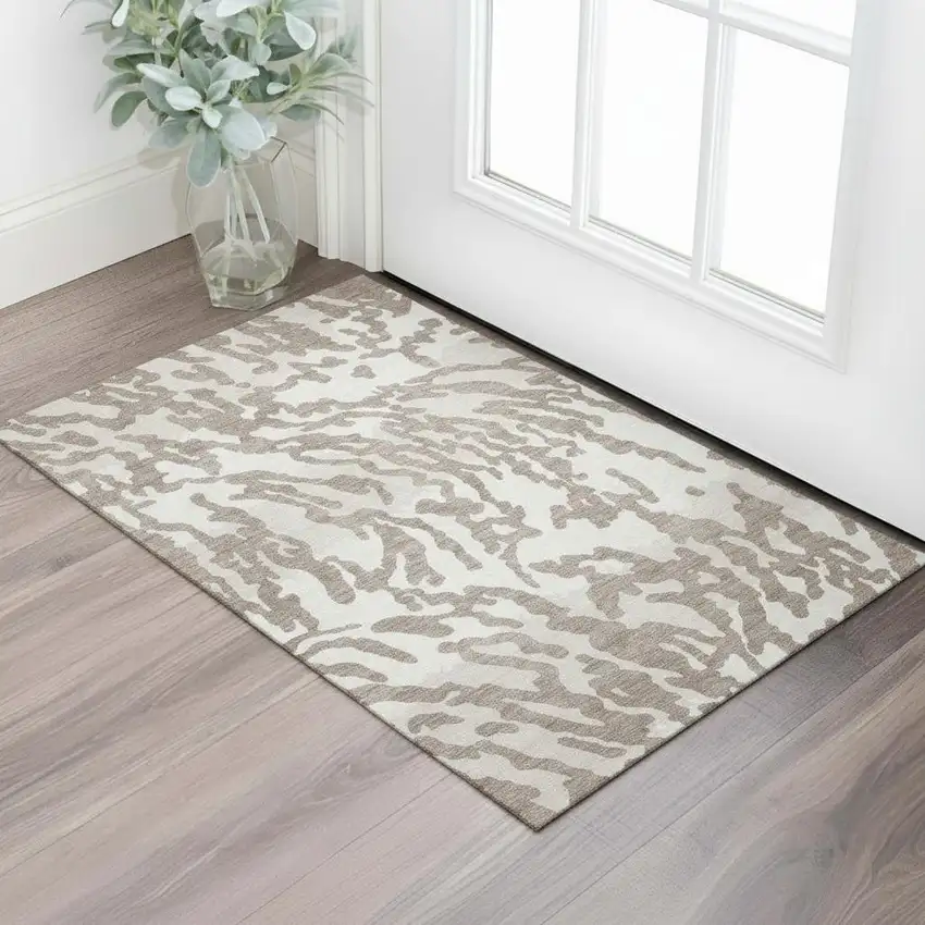 Taupe And Ivory Animal Print Washable Area Rug With UV Protection Photo 1