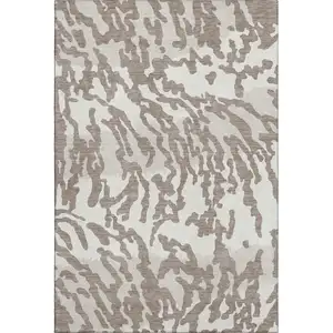 Photo of Taupe And Ivory Animal Print Washable Area Rug With UV Protection