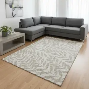 Photo of Taupe And Ivory Botanical Leaves Washable Area Rug With UV Protection