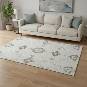 Photo of Taupe And Ivory Floral Medallion Washable Area Rug With UV Protection