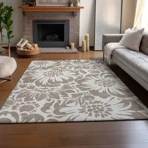 Photo of Taupe And Ivory Floral Washable Area Rug With UV Protection