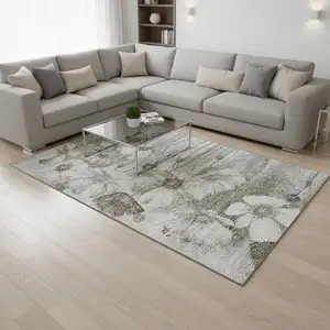 Photo of Taupe And Ivory Floral Washable Area Rug With UV Protection