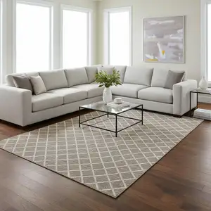 Photo of Taupe And Ivory Geometric Washable Area Rug With UV Protection