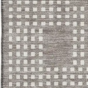 Photo of Taupe And Ivory Geometric Washable Area Rug With UV Protection