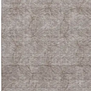 Photo of Taupe And Ivory Geometric Washable Area Rug With UV Protection
