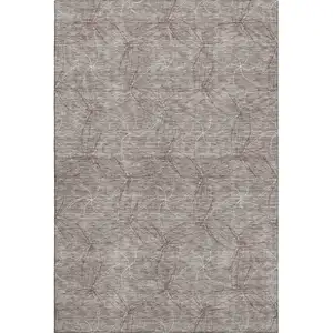 Photo of Taupe And Ivory Geometric Washable Area Rug With UV Protection