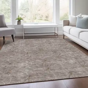 Photo of Taupe And Ivory Geometric Washable Area Rug With UV Protection