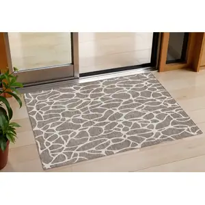 Photo of Taupe And Ivory Geometric Washable Indoor Outdoor Area Rug