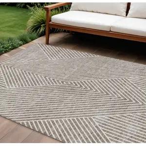Photo of Taupe And Ivory Geometric Washable Indoor Outdoor Area Rug