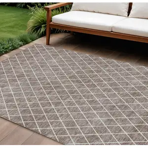 Photo of Taupe And Ivory Geometric Washable Indoor Outdoor Area Rug