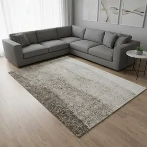 Photo of Taupe And Ivory Ombre Washable Area Rug With UV Protection