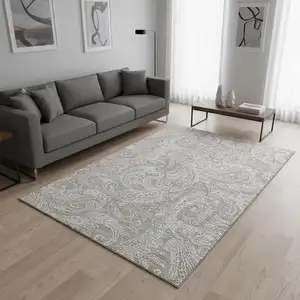 Photo of Taupe And Ivory Paisley Washable Area Rug With UV Protection