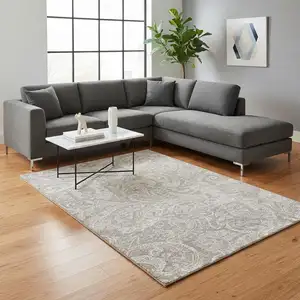 Photo of Taupe And Ivory Paisley Washable Area Rug With UV Protection