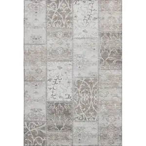 Photo of Taupe And Ivory Patchwork Washable Area Rug With UV Protection