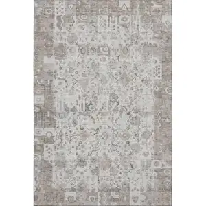 Photo of Taupe And Ivory Patchwork Washable Area Rug With UV Protection