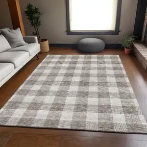 Photo of Taupe And Ivory Plaid Washable Area Rug With UV Protection