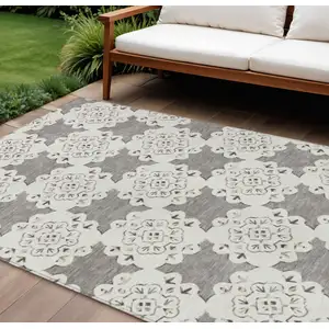 Photo of Taupe And Ivory Quatrefoil Washable Indoor Outdoor Area Rug