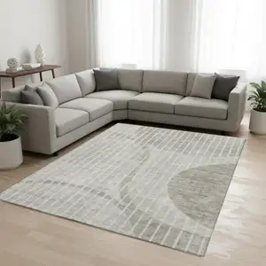 Photo of Taupe And Ivory Striped Washable Area Rug With UV Protection