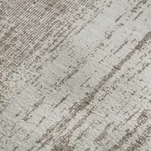 Photo of Taupe And Ivory Striped Washable Area Rug With UV Protection