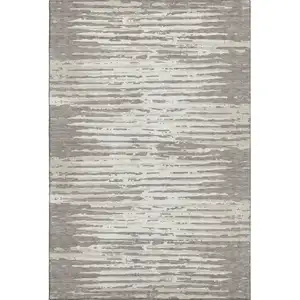 Photo of Taupe And Ivory Striped Washable Area Rug With UV Protection