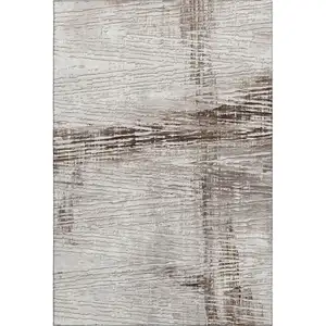 Photo of Taupe And Ivory Striped Washable Area Rug With UV Protection