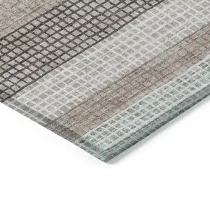 Photo of Taupe And Ivory Striped Washable Indoor Outdoor Area Rug