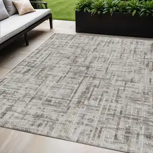 Photo of Taupe And Ivory Striped Washable Indoor Outdoor Area Rug