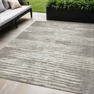 Photo of Taupe And Ivory Striped Washable Indoor Outdoor Area Rug